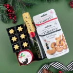 The Champagne and Treats Christmas Hamper – luxury festive gift hamper with premium champagne, chocolates, biscuits, and gourmet Christmas treats – perfect holiday food and drink gift for him, her, couples, or family.