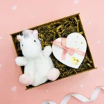You Are Magic Unicorn Plush & Chocolates Gift Box including a plush mini unicorn palm pal and a box of luxury chocolates.