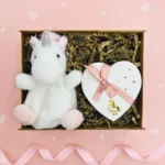 You Are Magic Unicorn Plush & Chocolates Gift Box including a plush mini unicorn palm pal and a box of luxury chocolates.