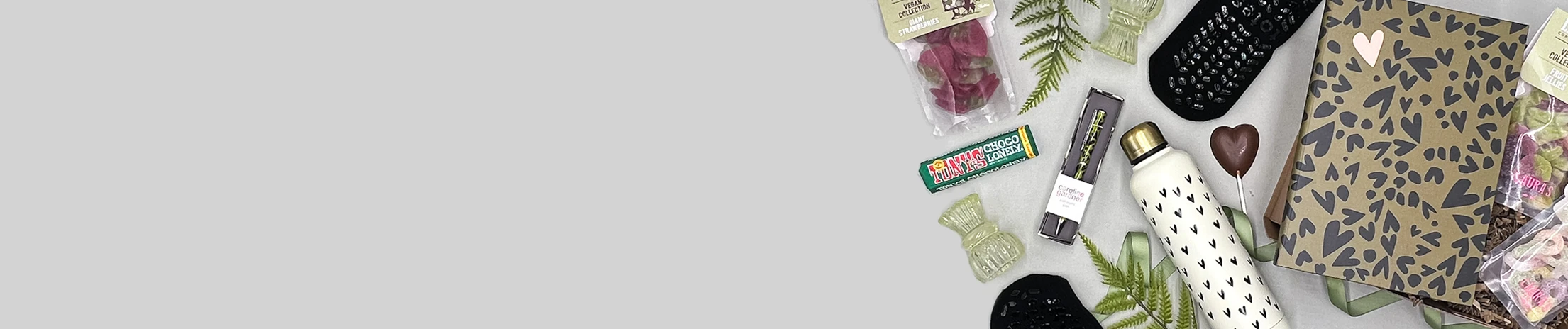 Teen birthday gift hamper with sweets, beauty items and fun treats arranged in a stylish box