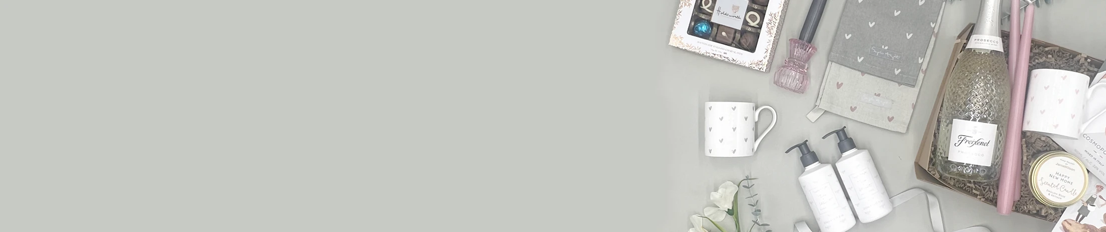 New home gift hamper with prosecco, candles and luxury treats for couples or anyone moving to a new home.