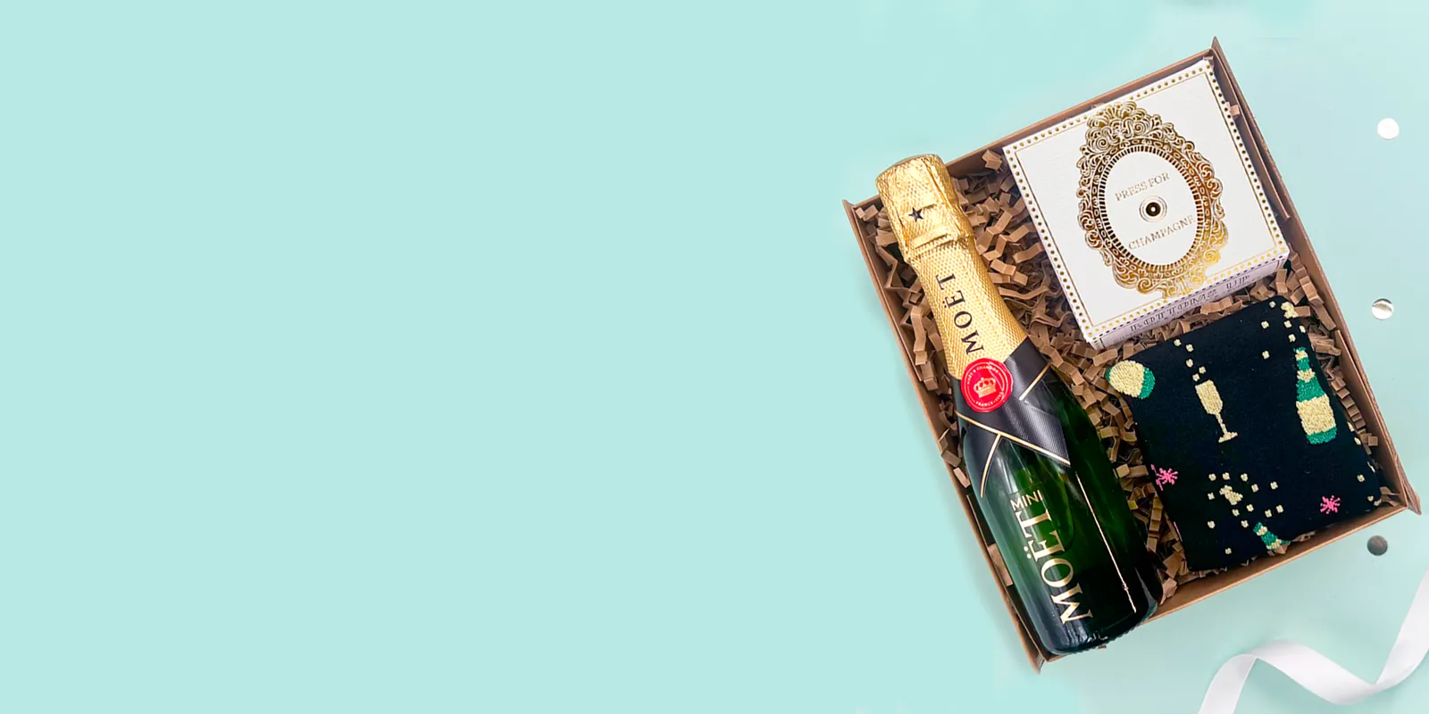 Selection of celebration gift hampers with drinks, chocolates and luxury treats