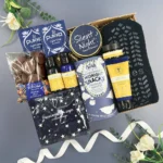 The New Mum Deluxe Survival Kit gift box featuring pampering treats, comforting snacks and thoughtful gifts designed to support and celebrate new mums.
