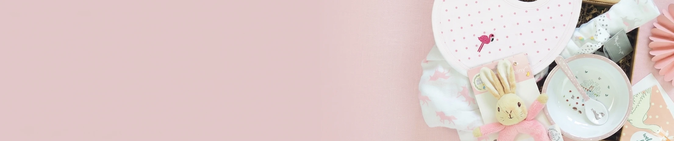 New baby gift hamper with baby clothes, toys and keepsakes.