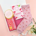 Motivational letterbox hamper with pink socks, chocolate and sweet treats