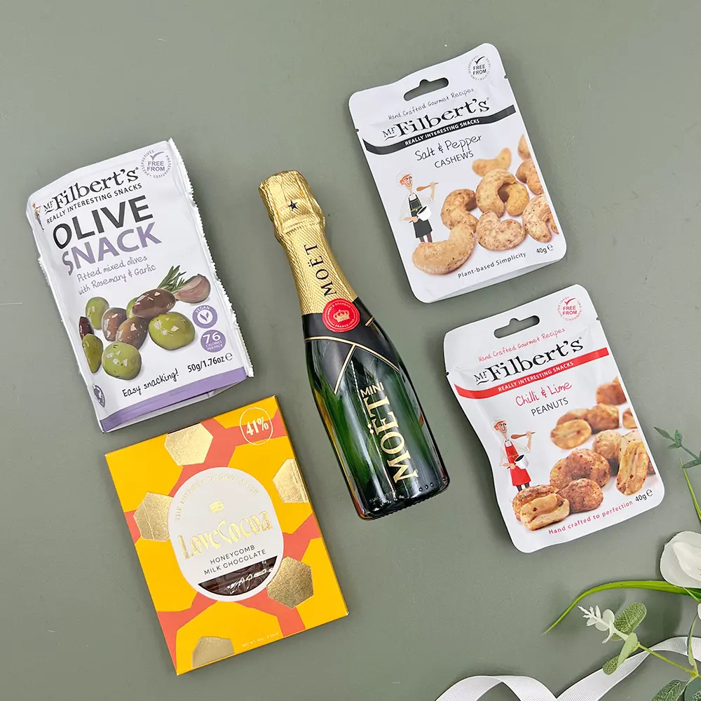 Champagne and nibbles gift box with mini champagne olives nuts and dark chocolate hamper