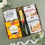Father’s Day gourmet gift hamper featuring mini Moët champagne, artisan chocolate, olives, peanuts, and cashews in a luxury gift box for dads and special celebrations.