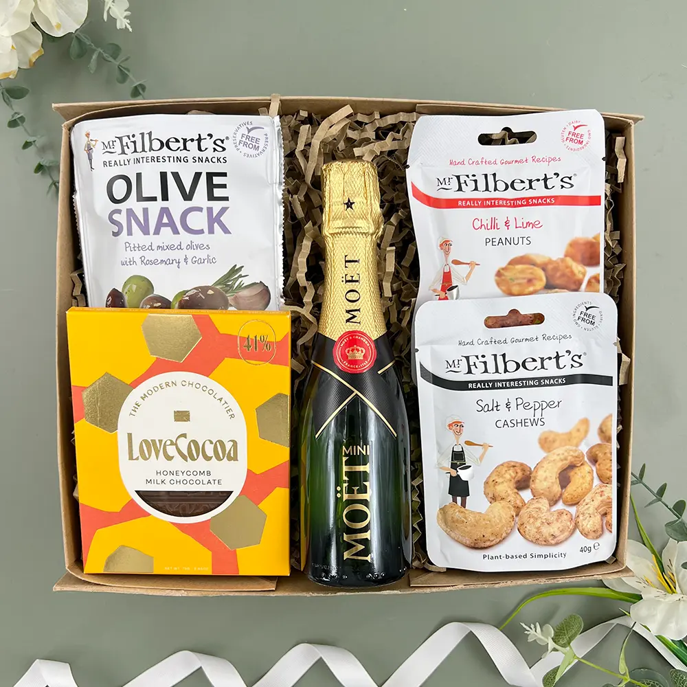 Champagne and nibbles gift box with mini champagne olives nuts and dark chocolate hamper