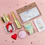 18th birthday gift box for her with mini Prosecco, birthday cake popcorn, Prosecco gummy sweets, chocolate hearts, birthday candle, bath bomb and gold party crown.