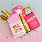 30th birthday gift box for her featuring birthday cake popcorn, mini Prosecco, luxury chocolate, bath salts, scented candle and a gold party crown.