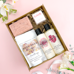 Bath & Body Pamper Hamper For Her featuring Bramley Body Wash and Body Lotion, aromatherapy bath salts, rose soap, and a Lovely lip balm presented in a kraft gift box.
