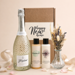 Luxury new home gift hamper featuring a bottle of Prosecco, Bramley bubble bath and body lotion, a dried flower arrangement in a glass vase, and a 