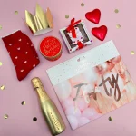 Elegant 40th birthday hamper for her featuring a gold crown, red heart chocolates, a golden sparkling drink bottle, chocolate gift box, and red heart-patterned socks in a decorative gift box.