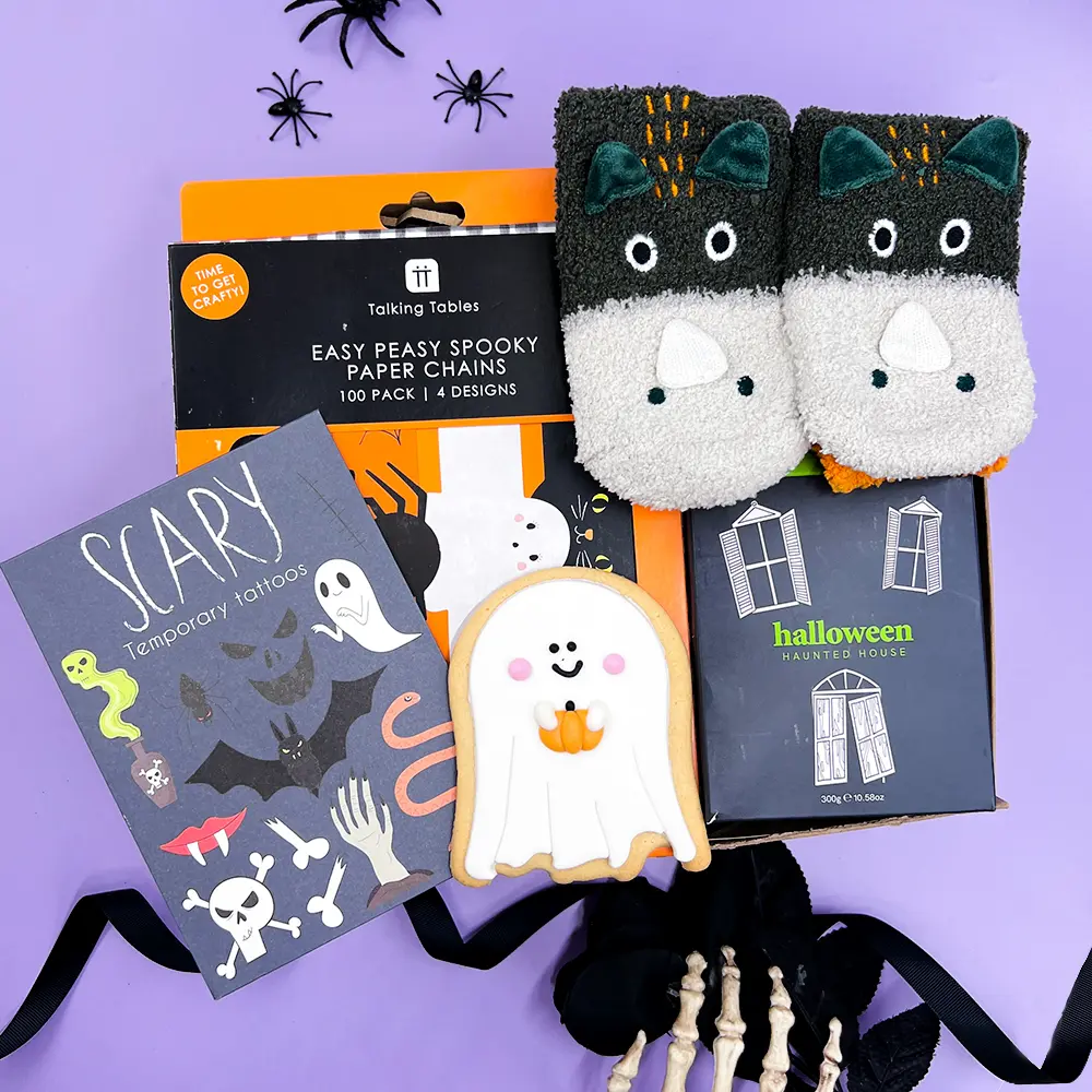 Happy Vibes Letterbox Gift with The Happy Newspaper, chocolate, colourful socks and jelly beans