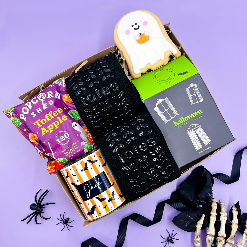 Happy Vibes Letterbox Gift with The Happy Newspaper, chocolate, colourful socks and jelly beans